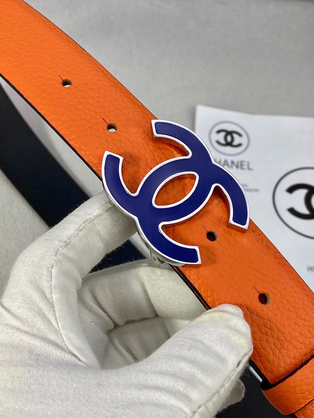 CHANEL 30MM BELT IN FIRE ORANGE GRAINED CALFSKIN WITH NAVY BLUE METAL LOGO