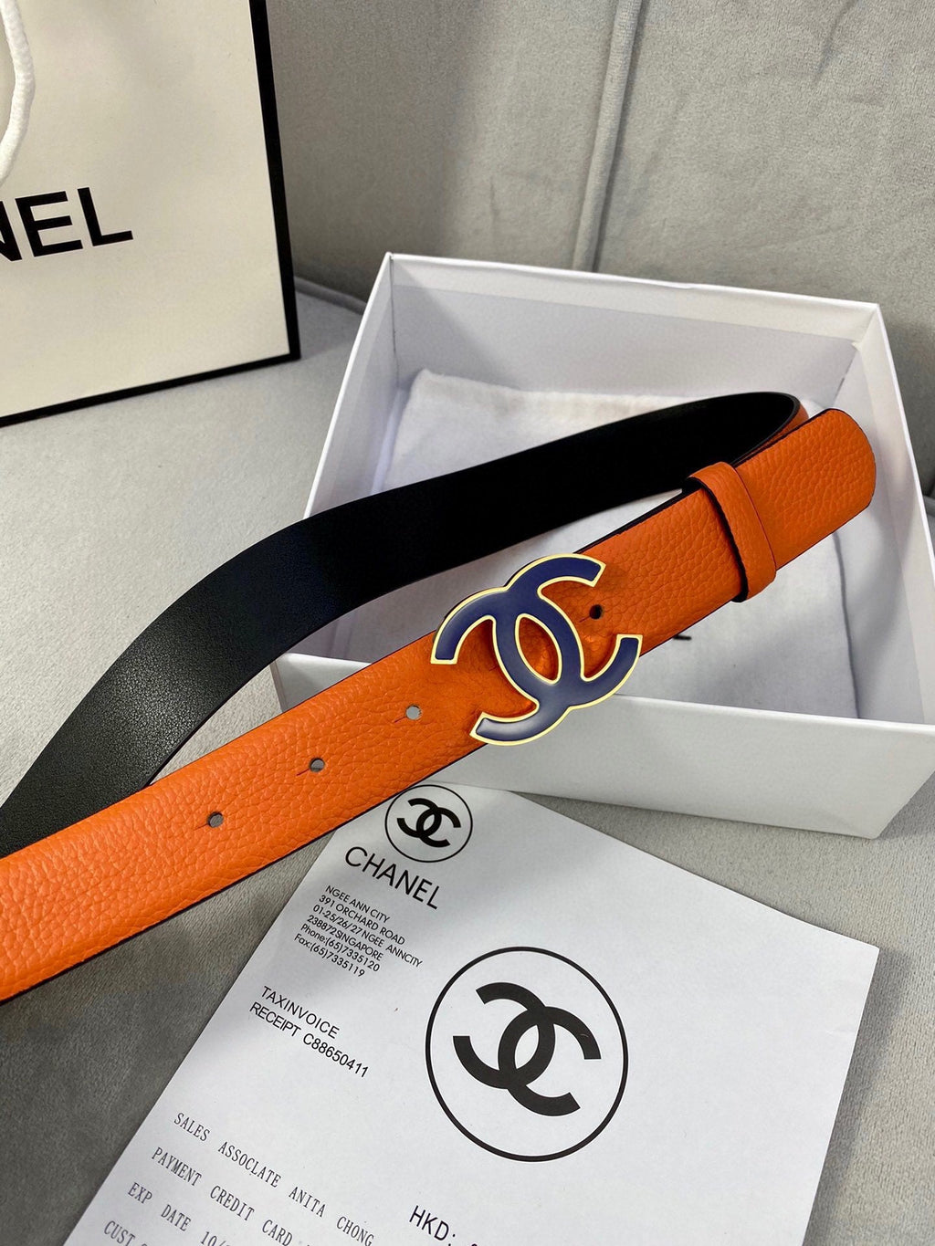 CHANEL 30MM BELT IN FIRE ORANGE GRAINED CALFSKIN WITH NAVY BLUE METAL LOGO