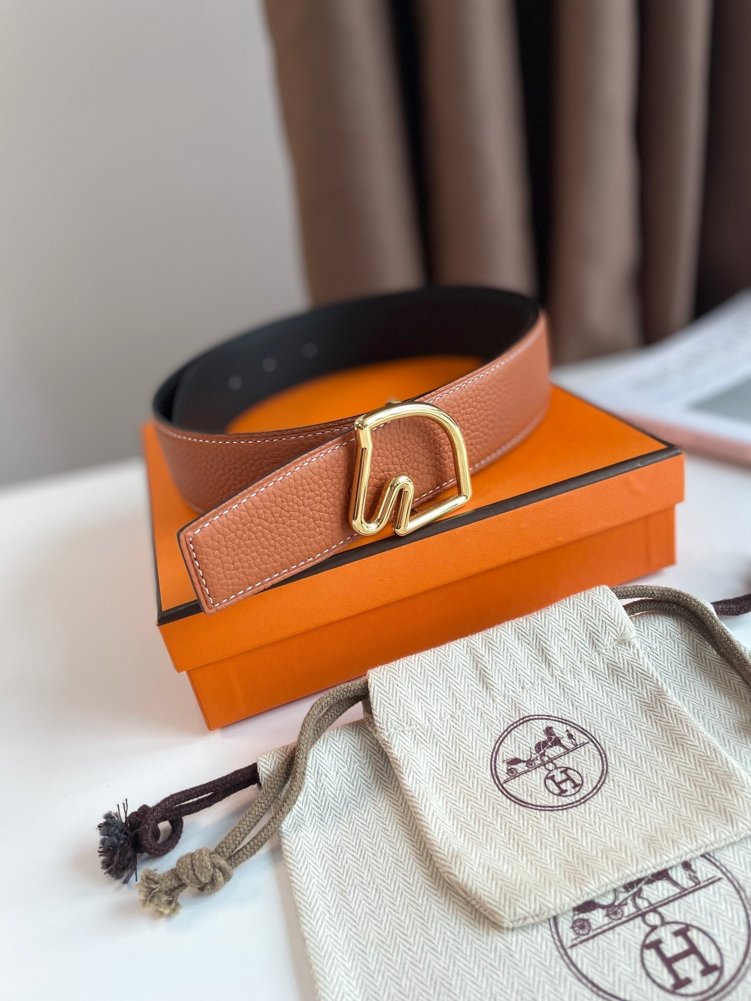 HERMES BOUCLE BELT BUCKLE & REVERSIBLE GINGER ORANGE AND BLACK LEATHER STRAP 38MM GOLD HARDWARE