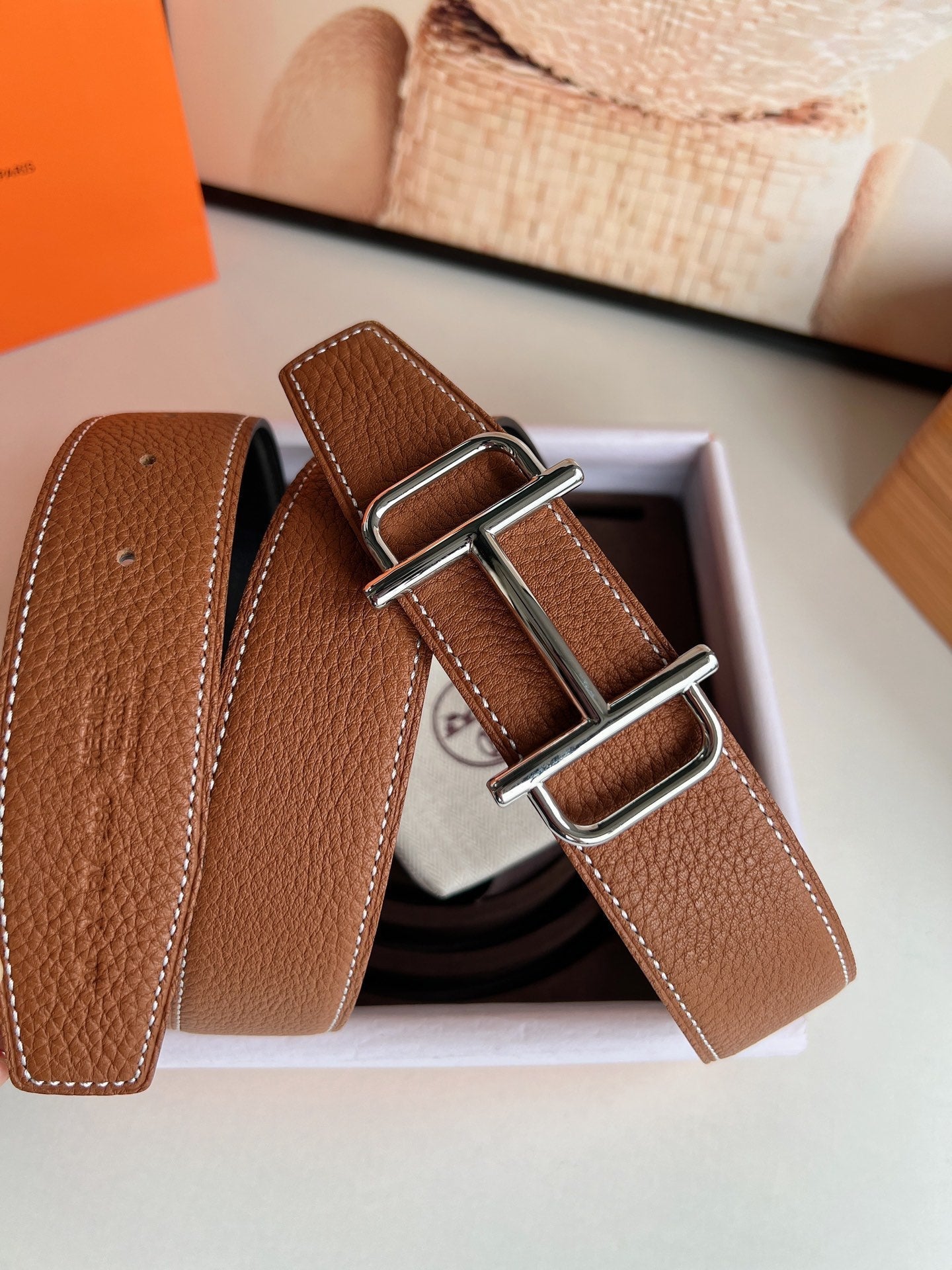 HERMES ROYAL BELT BUCKLE & REVERSIBLE NOIR AND CIDER ORANGE LEATHER STRAP 32 MM SILVER HARDWARE