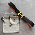 HERMES BELT BUCKLE & REVERSIBLE BLACK AND ORANGE LEATHER STRAP 38MM GOLD HARDWARE