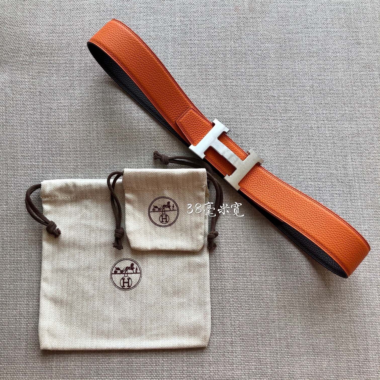 HERMES BELT BUCKLE & REVERSIBLE BLACK AND ORANGE LEATHER STRAP 38MM SILVER HARDWARE