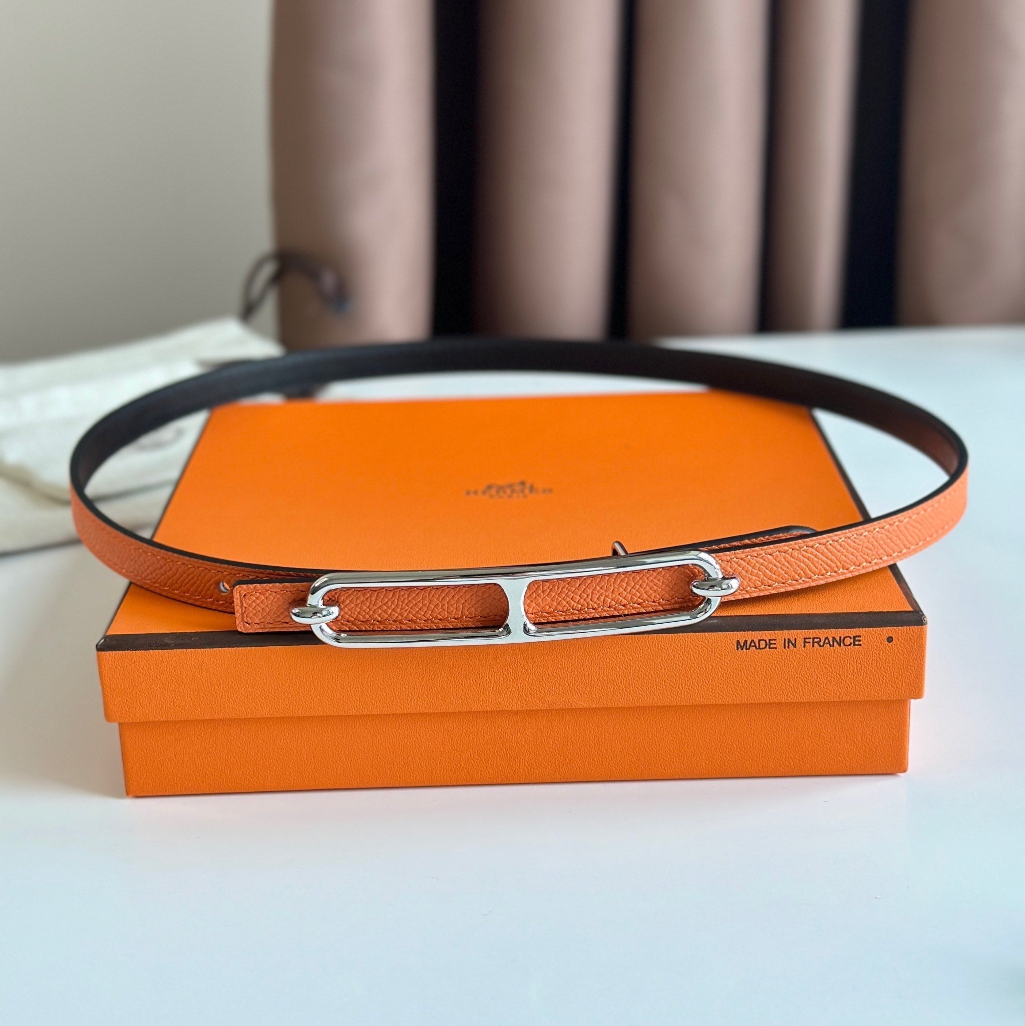 HERMES ROULIS BUCKLE & REVERSIBLE ORANGE AND BLACK LEATHER STRAP 13MM SILVER HARDWARE