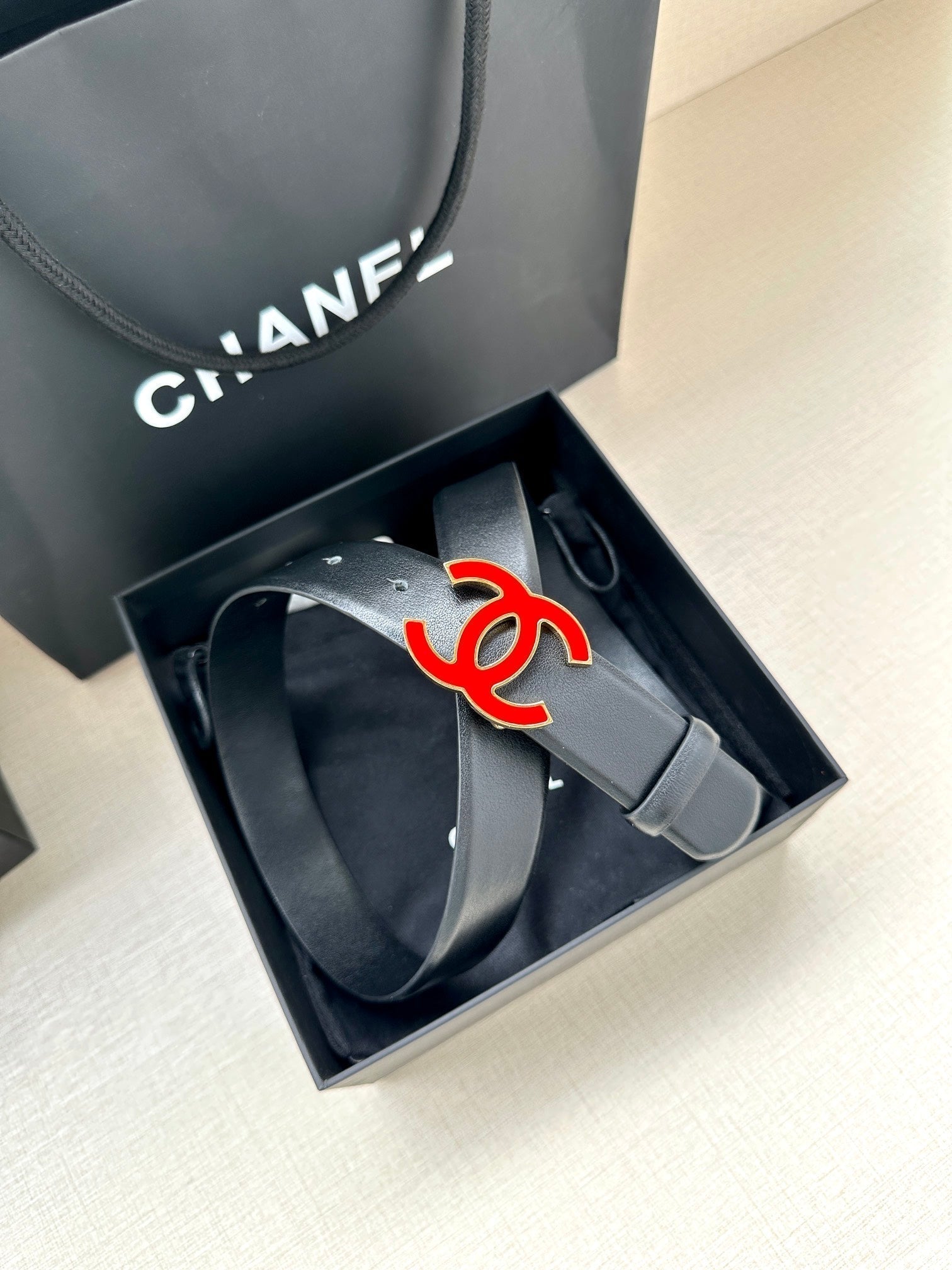 CHANEL 30MM BELT IN BLACK SMOOTH CALFSKIN WITH RED METAL LOGO