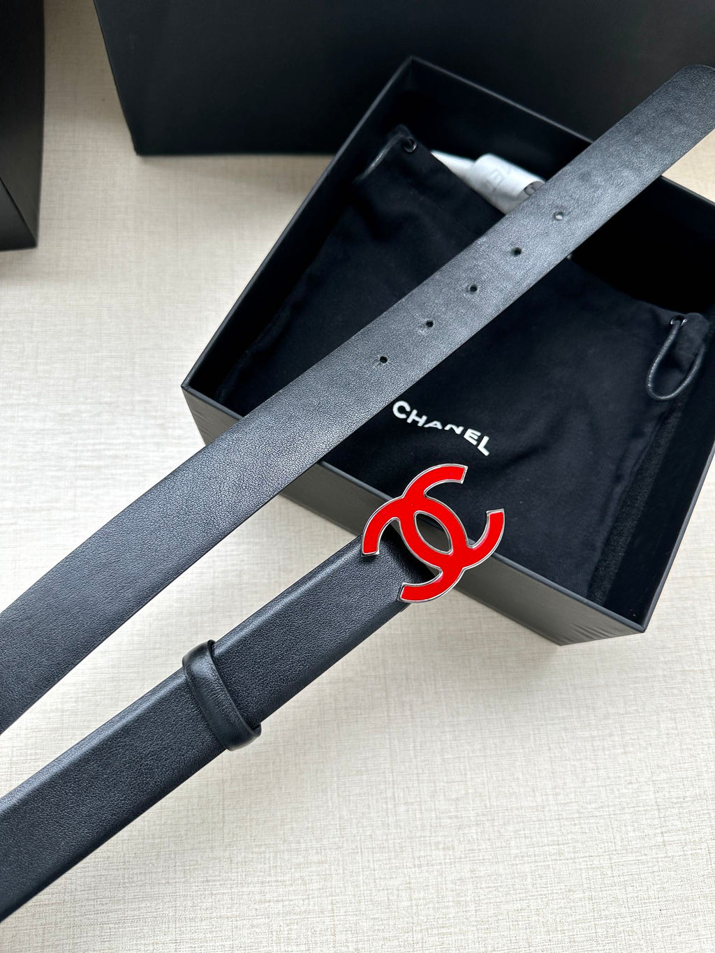 CHANEL 30MM BELT IN BLACK SMOOTH CALFSKIN WITH RED METAL LOGO