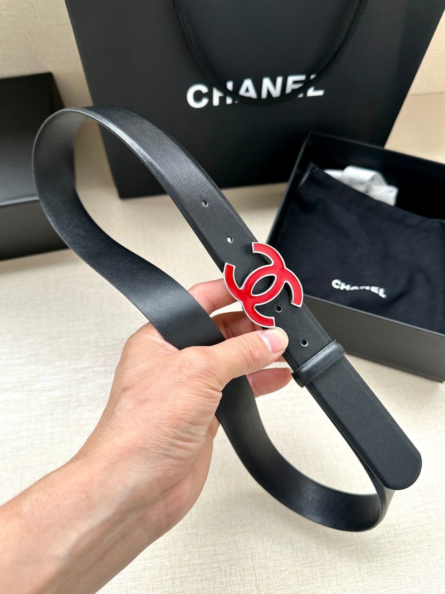 CHANEL 30MM BELT IN BLACK SMOOTH CALFSKIN WITH RED METAL LOGO