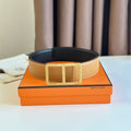 HERMES BELT BUCKLE & REVERSIBLE ORANGE PASTEL AND BLACK LEATHER STRAP 38MM GOLD HARDWARE