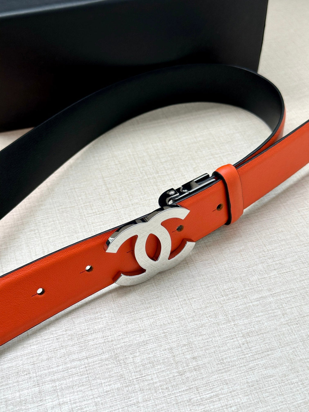 CHANEL 30MM BELT IN FIRE ORANGE AND BLACK CALFSKIN WITH SILVER HARDWARE