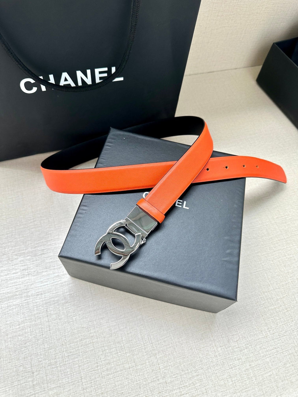 CHANEL 30MM BELT IN FIRE ORANGE AND BLACK CALFSKIN WITH SILVER HARDWARE