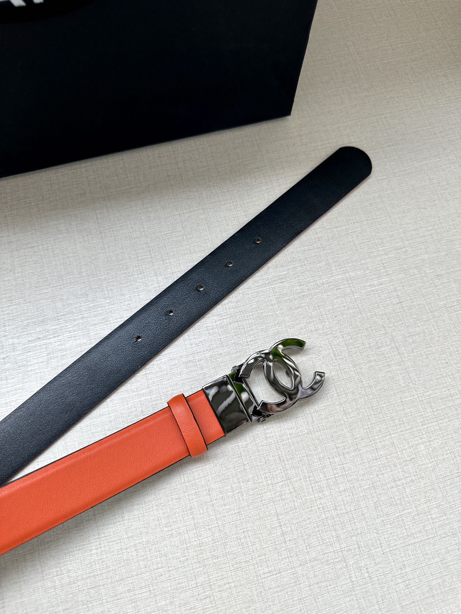 CHANEL 30MM BELT IN FIRE ORANGE AND BLACK CALFSKIN WITH SILVER HARDWARE