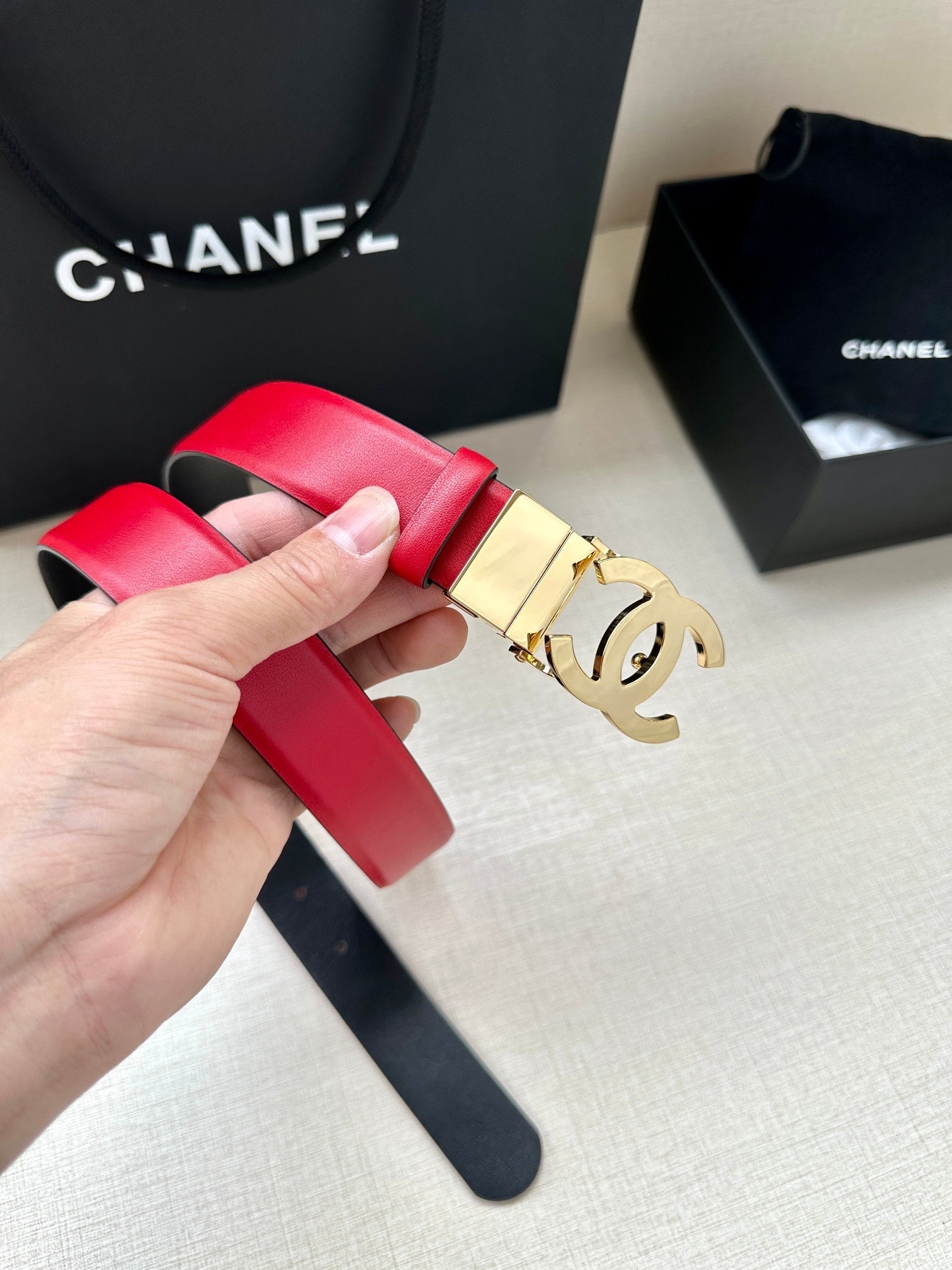 CHANEL 30MM BELT IN CHERRY RED AND BLACK CALFSKIN WITH GOLD HARDWARE