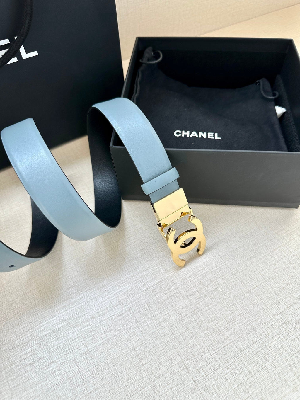 CHANEL 30MM BELT IN STONE BLUE AND BLACK CALFSKIN WITH GOLD HARDWARE