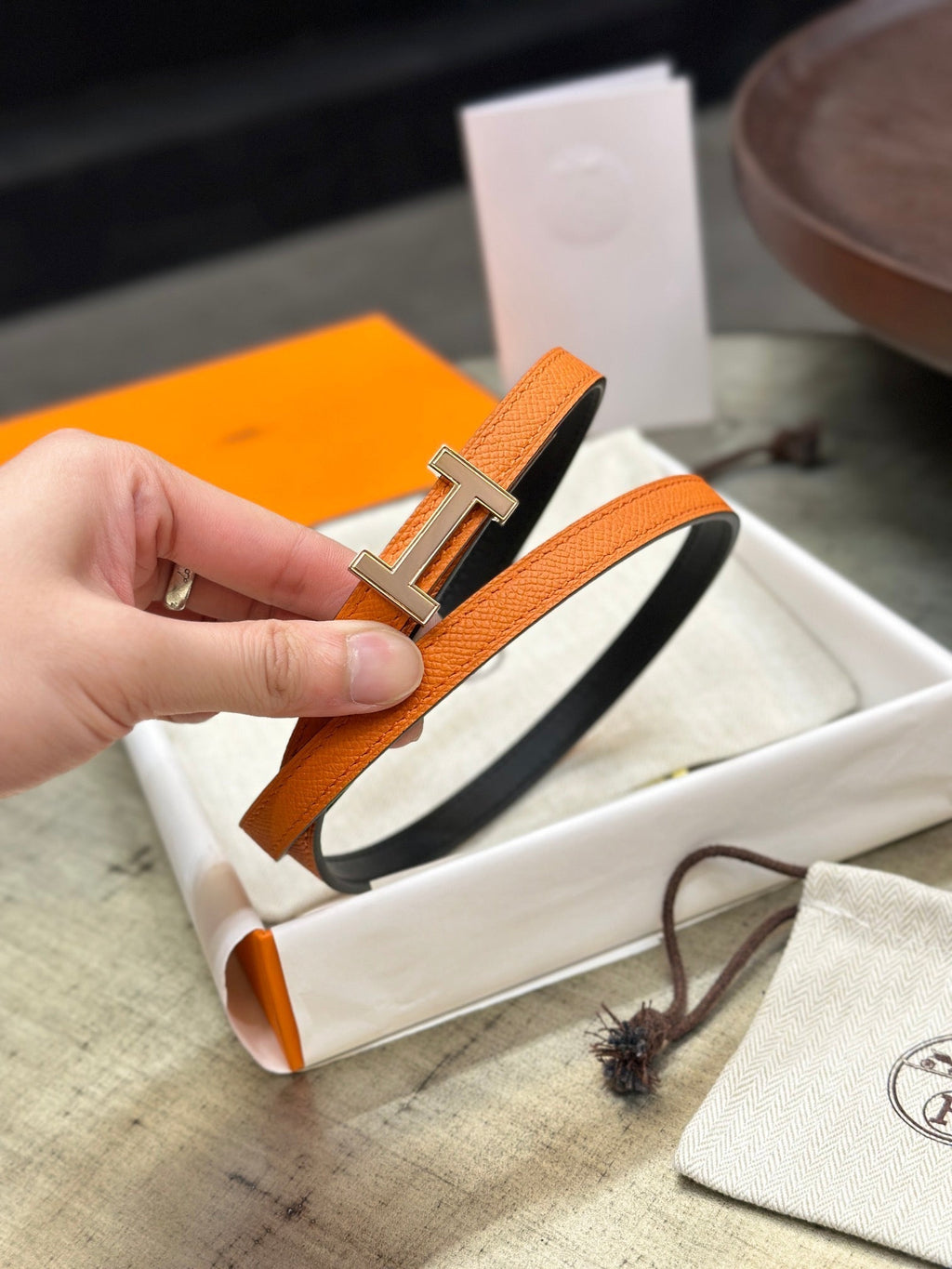 HERMES FOCUS BUCKLE & REVERSIBLE BLACK AND ORANGE LEATHER STRAP 13MM COPPER HARDWARE