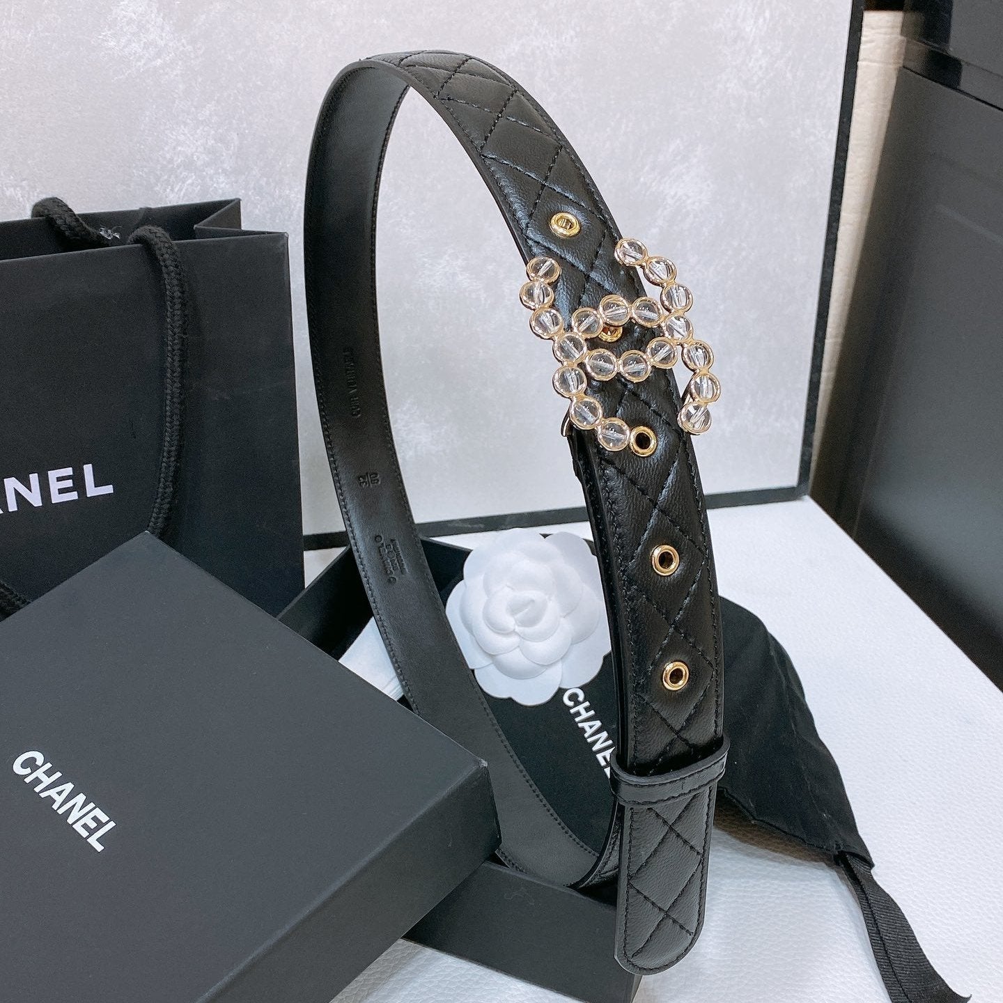 CHANEL BELT 30 MM IN BLACK EMBROIDERED CALFSKIN PEARL LOGO WITH GOLD HARDWARE