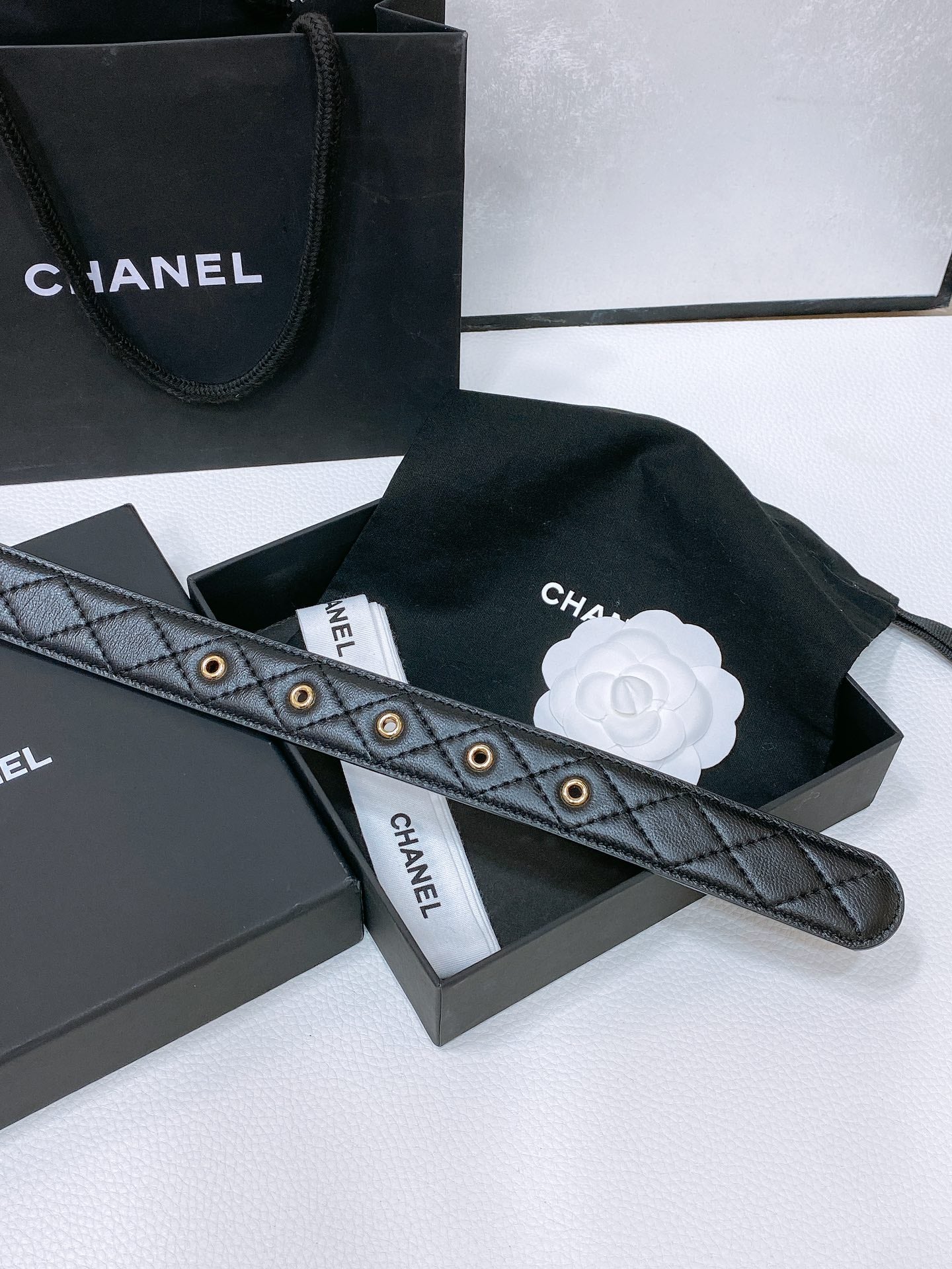 CHANEL BELT 30 MM IN BLACK EMBROIDERED CALFSKIN PEARL LOGO WITH GOLD HARDWARE