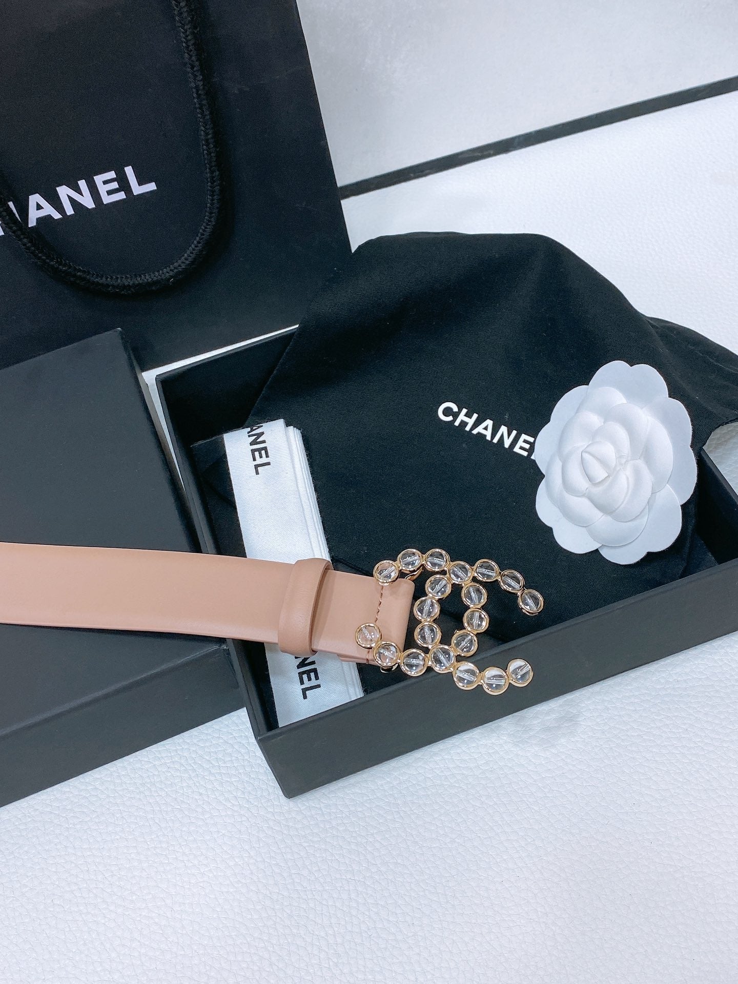 CHANEL BELT 30 MM IN ALMOND BEIGE CALFSKIN PEARL LOGO WITH GOLD HARDWARE