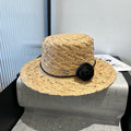 MIU MIU MM STRAW HAT IN BEIGE RAFFIA WITH BLACK FLOWER ACCENT