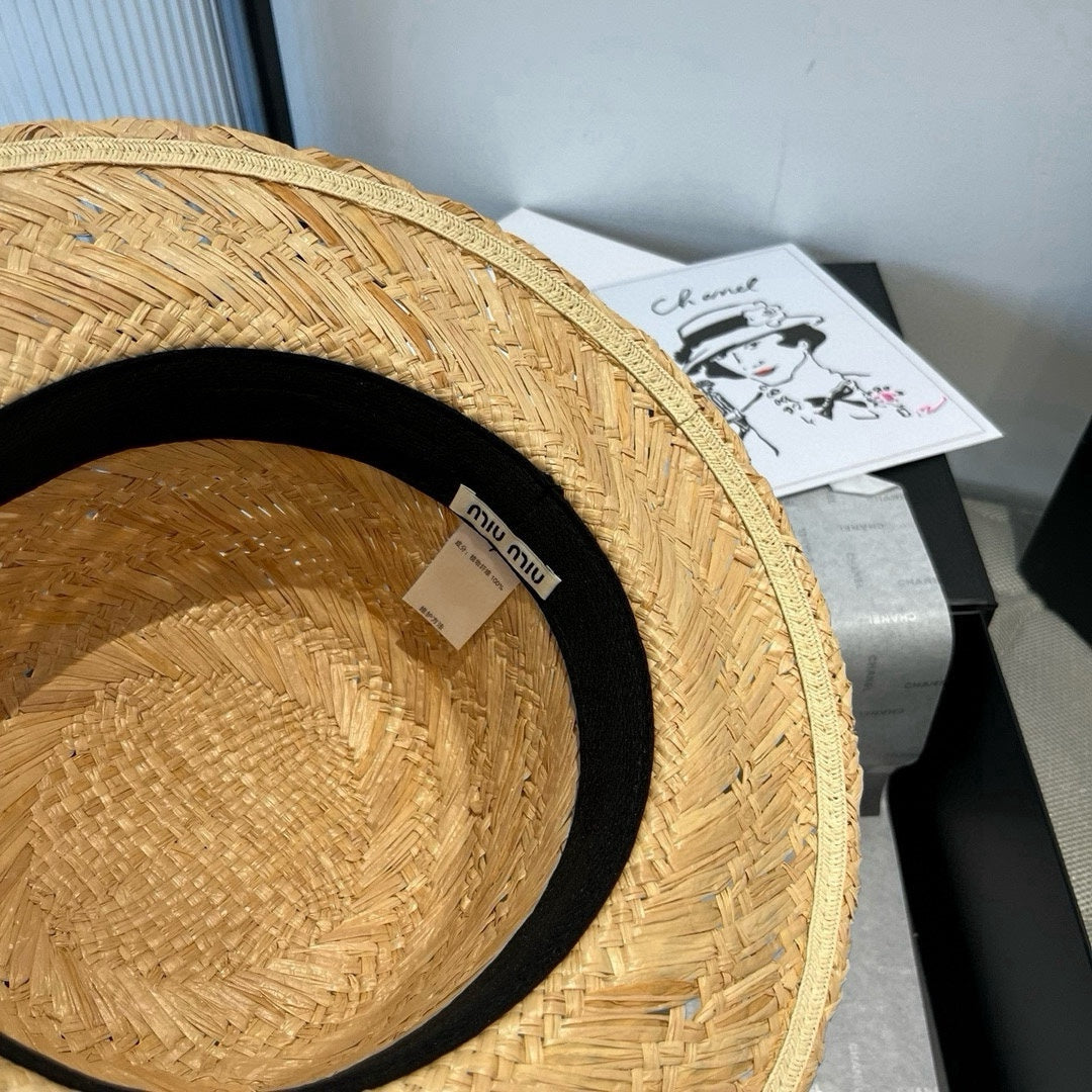 MIU MIU MM STRAW HAT IN BEIGE RAFFIA WITH BLACK FLOWER ACCENT