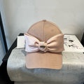 MIU MIU MM BASEBALL CAP IN BEIGE FABRIC WITH LARGE PINK BOW