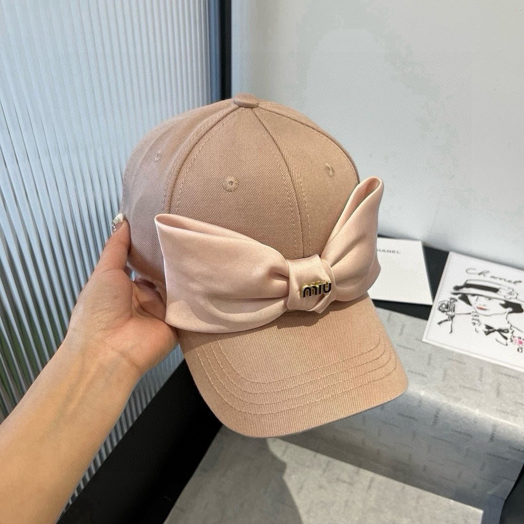MIU MIU MM BASEBALL CAP IN BEIGE FABRIC WITH LARGE PINK BOW