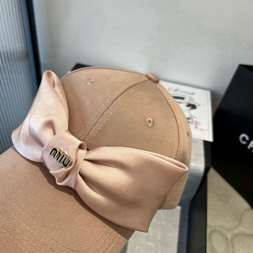 MIU MIU MM BASEBALL CAP IN BEIGE FABRIC WITH LARGE PINK BOW