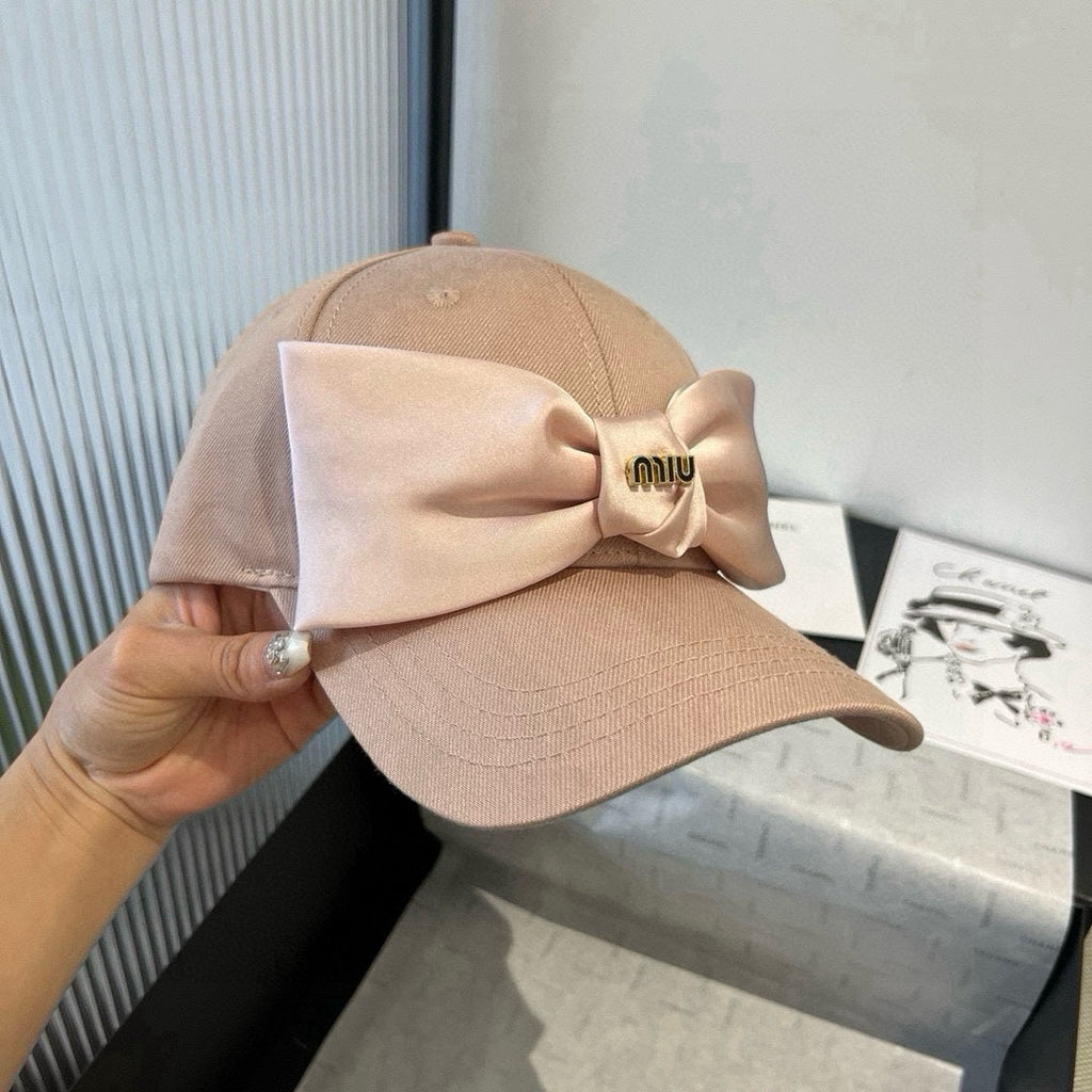 MIU MIU MM BASEBALL CAP IN BEIGE FABRIC WITH LARGE PINK BOW