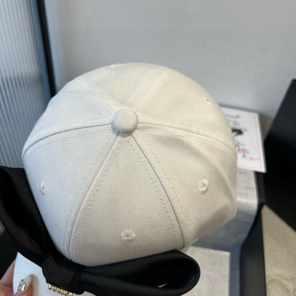 MIU MIU MM BASEBALL CAP IN WHITE FABRIC WITH LARGE BLACK BOW