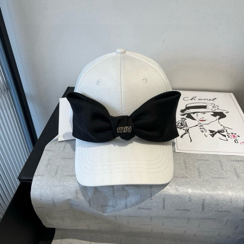 MIU MIU MM BASEBALL CAP IN WHITE FABRIC WITH LARGE BLACK BOW