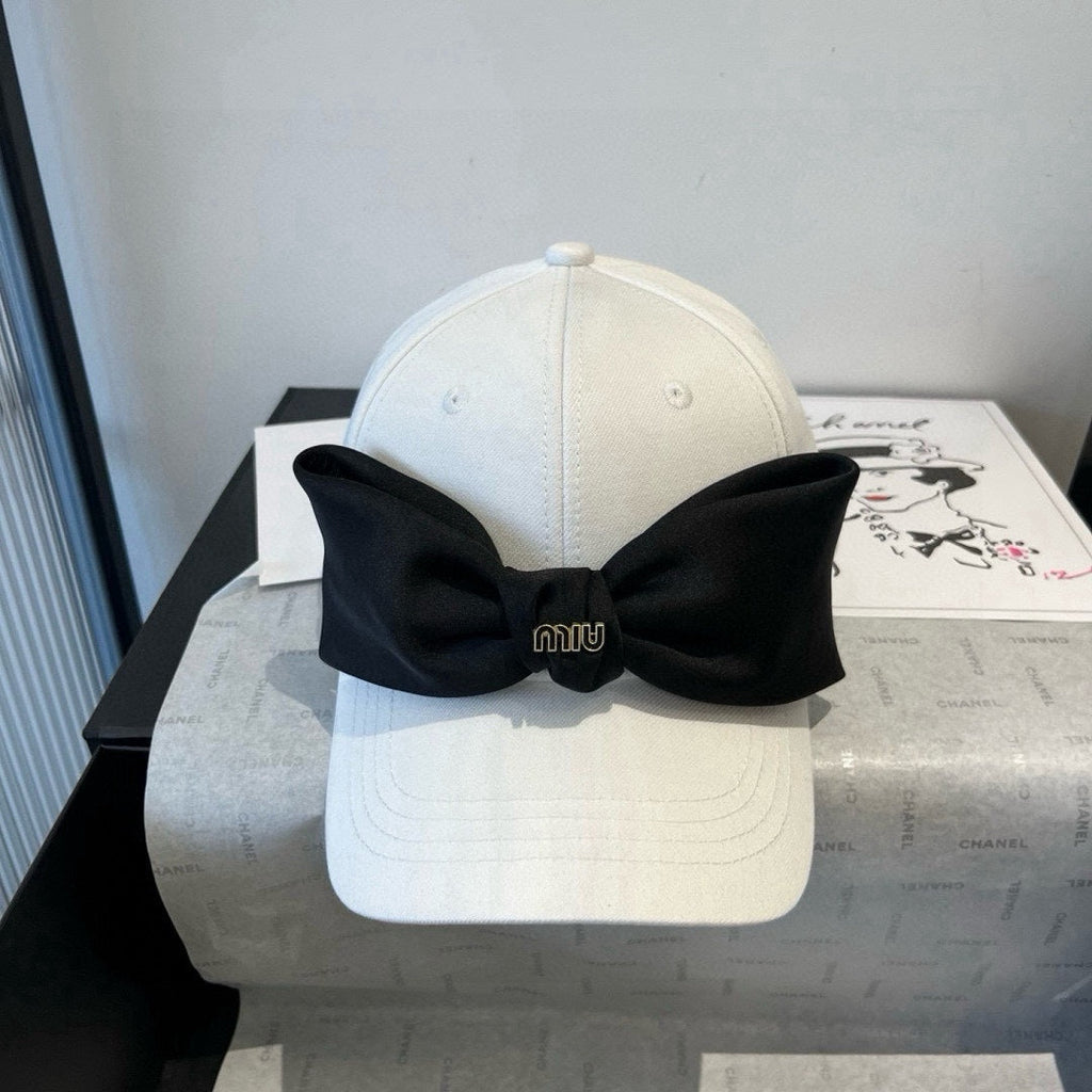 MIU MIU MM BASEBALL CAP IN WHITE FABRIC WITH LARGE BLACK BOW