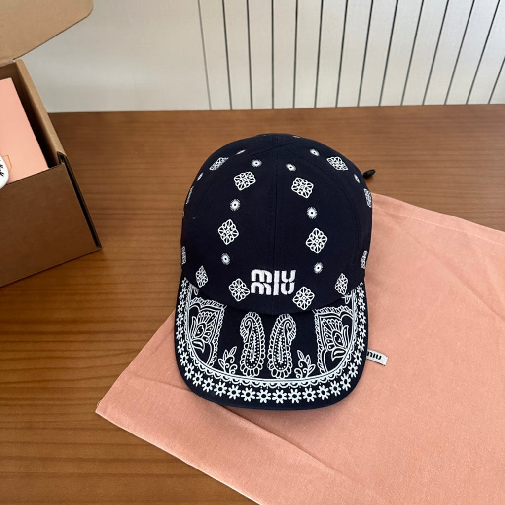 MIU MIU MM BASEBALL CAP IN BLACK WITH WHITE EMBROIDERED PATTERN