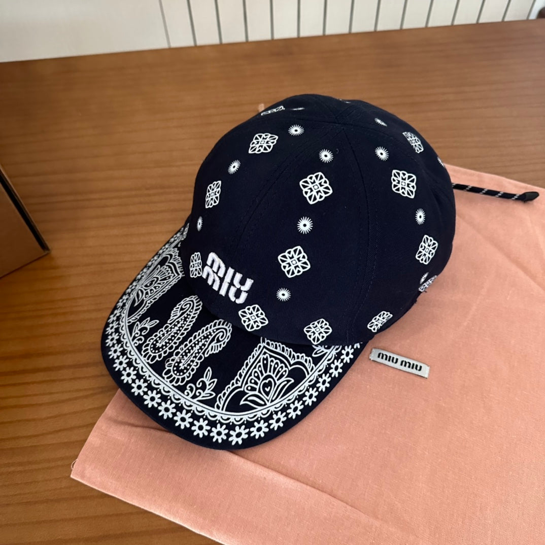 MIU MIU MM BASEBALL CAP IN BLACK WITH WHITE EMBROIDERED PATTERN