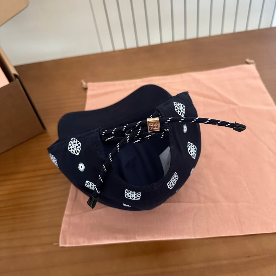 MIU MIU MM BASEBALL CAP IN BLACK WITH WHITE EMBROIDERED PATTERN