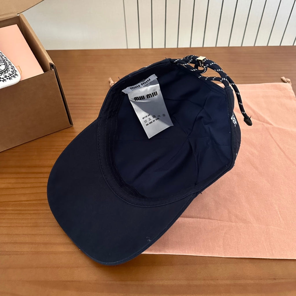 MIU MIU MM BASEBALL CAP IN BLACK WITH WHITE EMBROIDERED PATTERN