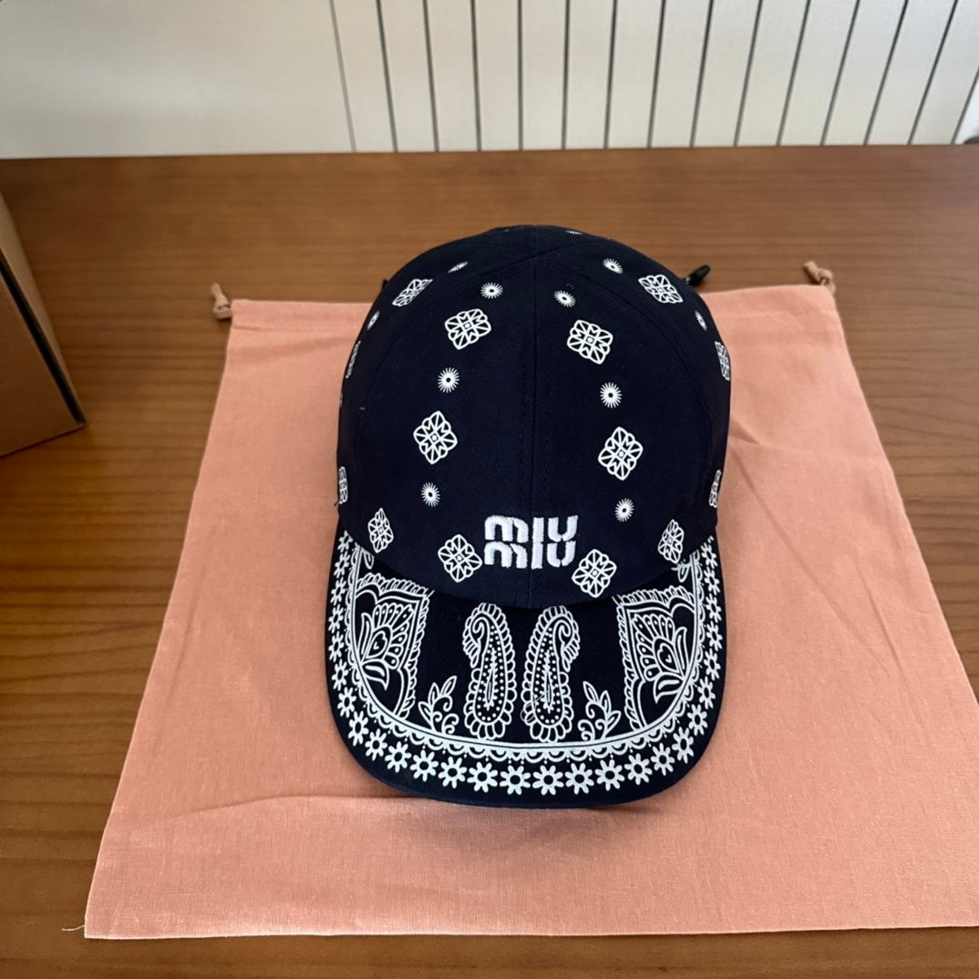 MIU MIU MM BASEBALL CAP IN BLACK WITH WHITE EMBROIDERED PATTERN