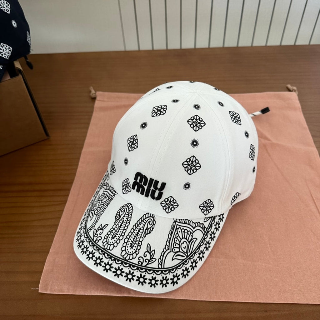 MIU MIU MM BASEBALL CAP IN WHITE WITH BLACK EMBROIDERED PATTERN
