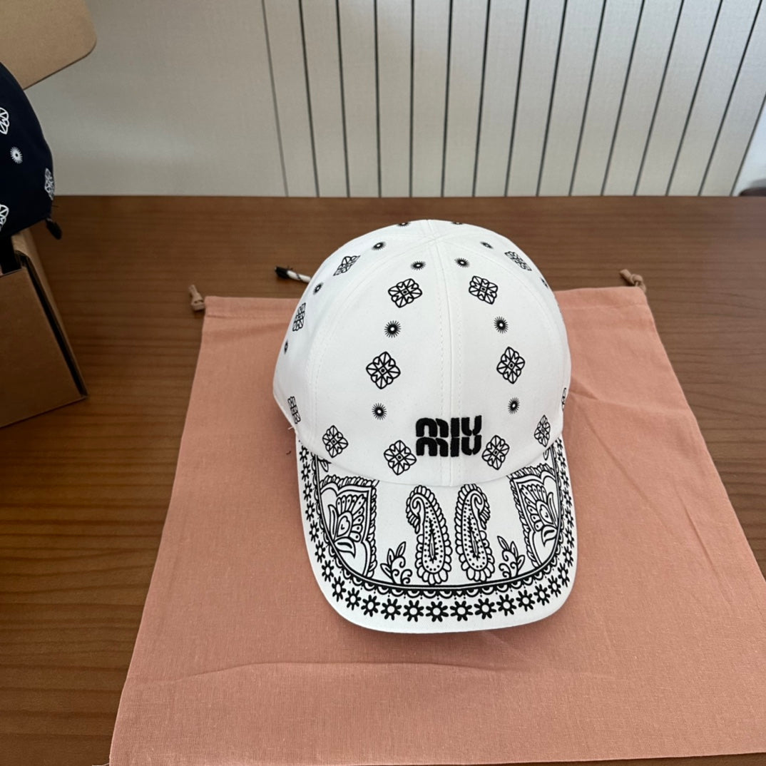 MIU MIU MM BASEBALL CAP IN WHITE WITH BLACK EMBROIDERED PATTERN