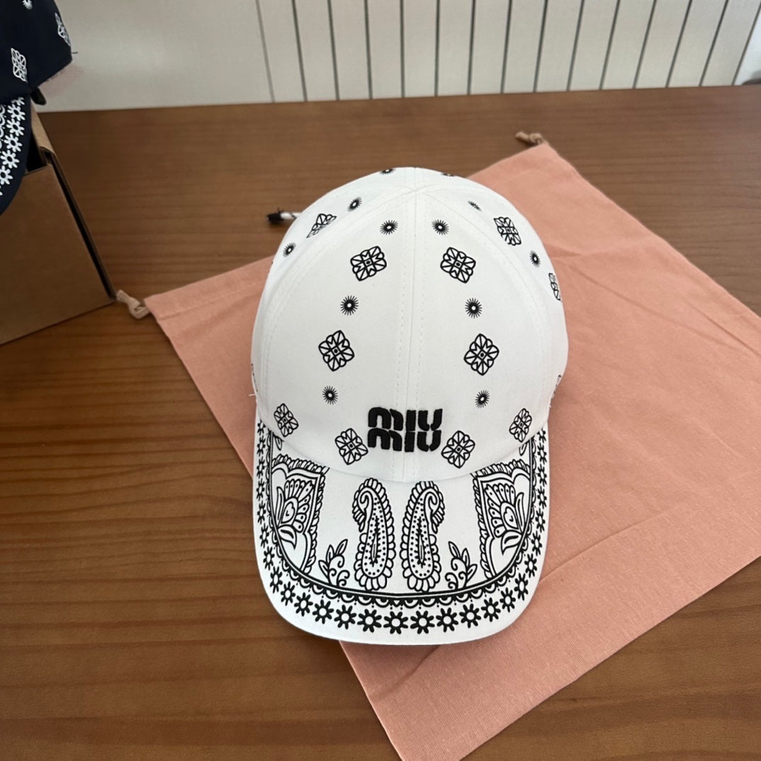 MIU MIU MM BASEBALL CAP IN WHITE WITH BLACK EMBROIDERED PATTERN