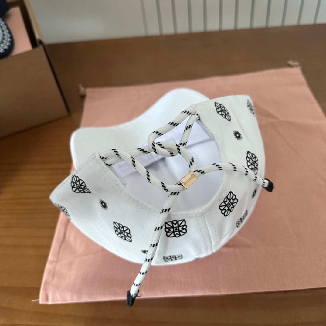 MIU MIU MM BASEBALL CAP IN WHITE WITH BLACK EMBROIDERED PATTERN