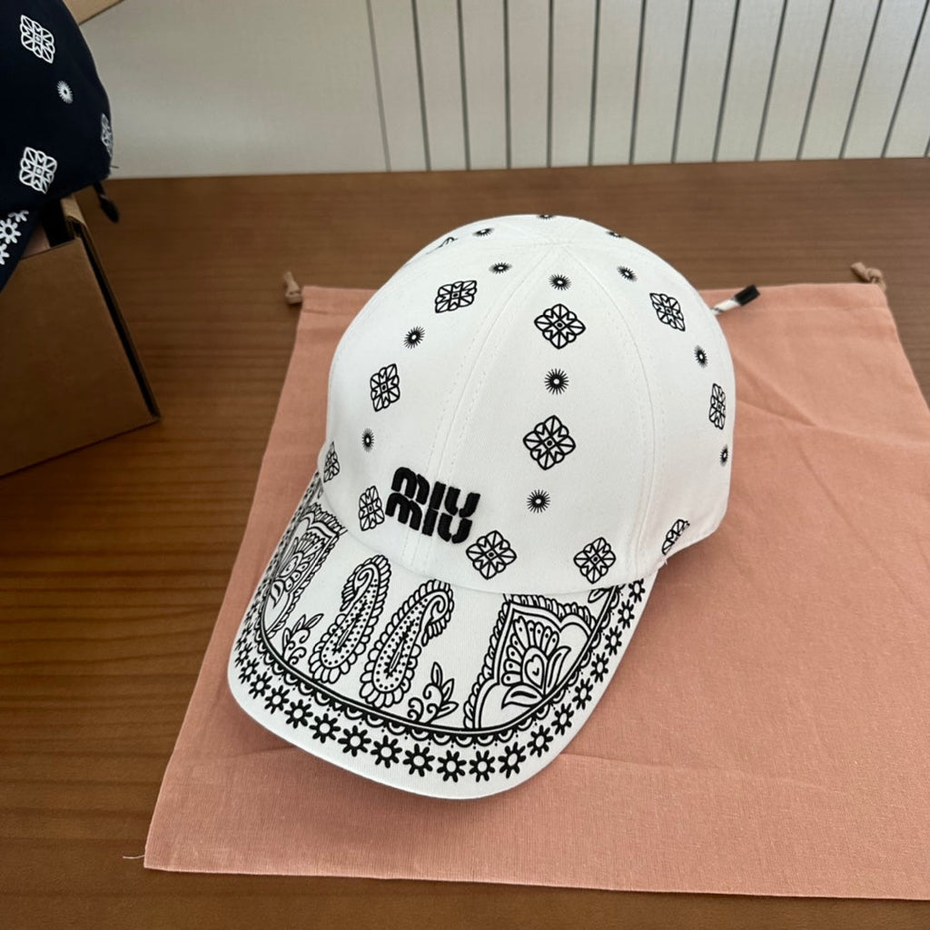 MIU MIU MM BASEBALL CAP IN WHITE WITH BLACK EMBROIDERED PATTERN