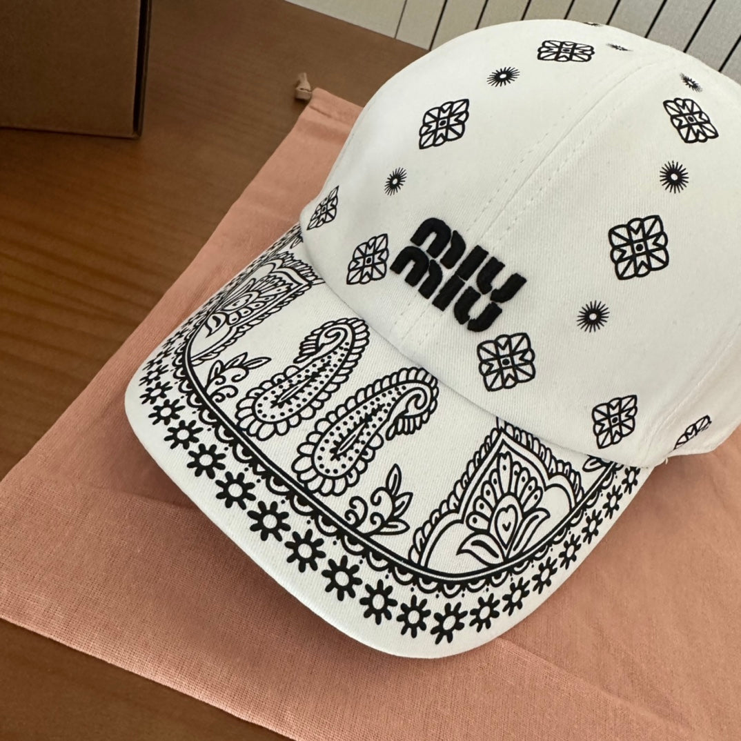 MIU MIU MM BASEBALL CAP IN WHITE WITH BLACK EMBROIDERED PATTERN