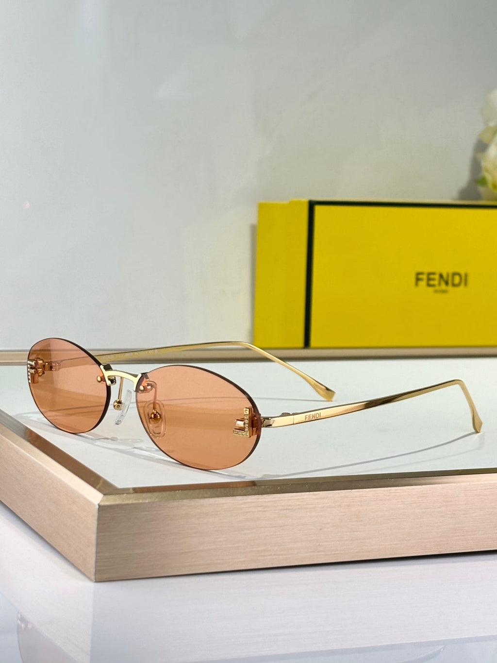 FENDI FIRST CRYSTAL RIMLESS OVAL FRAME SUNGLASSES FE4075US IN METAL