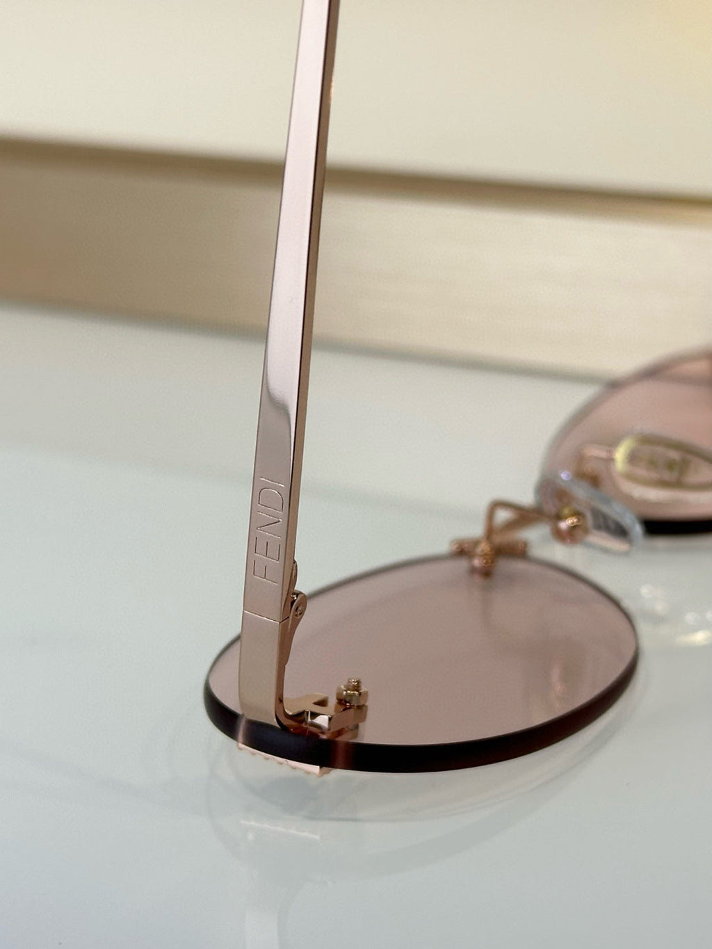 FENDI FIRST CRYSTAL RIMLESS OVAL FRAME SUNGLASSES FE4075US IN METAL