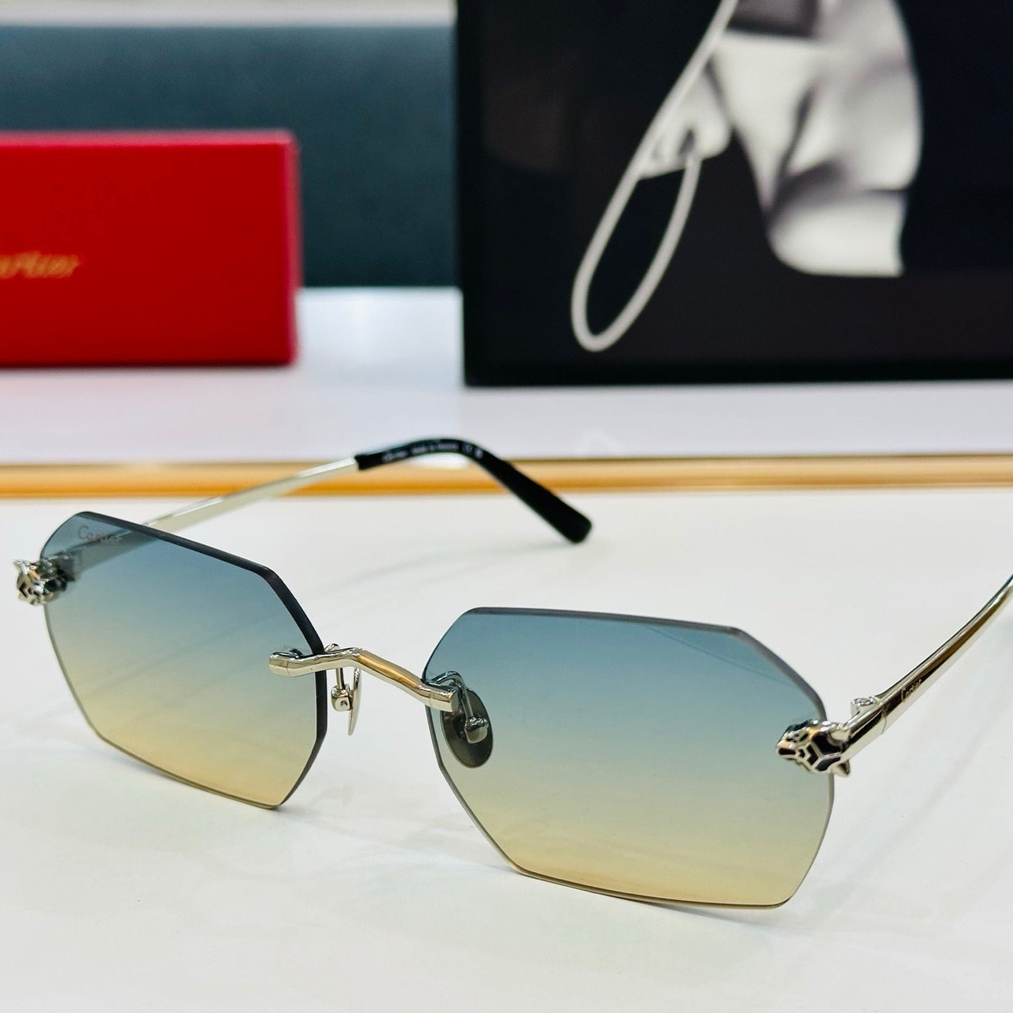 CARTIER PANTHÈRE RIMLESS GEOMETRIC FRAME SUNGLASSES CT0504S IN METAL