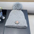 MONCLER BEANIE HAT IN ASH GRAY WOOL WITH POM POM 438107