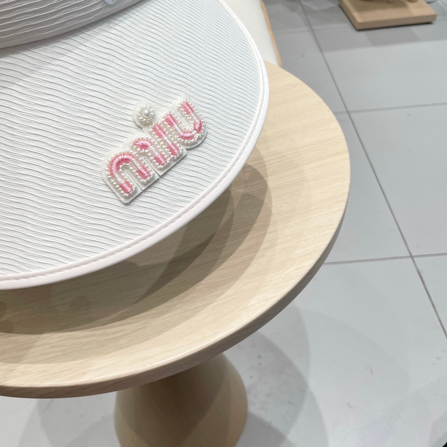 MIU MIU MM FASHION VISOR CAP IN BLACK AND WHITE WITH LOGO TEXT EMBROIDERY