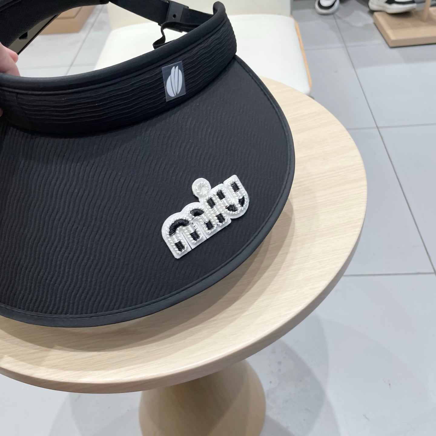 MIU MIU MM FASHION VISOR CAP IN BLACK AND WHITE WITH LOGO TEXT EMBROIDERY