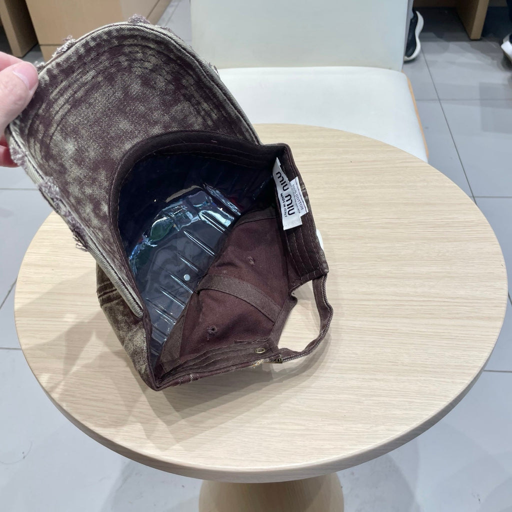 MIU MIU MM DISTRESSED FABRIC BASEBALL CAP IN BROWN WITH EMBROIDERED LOGO
