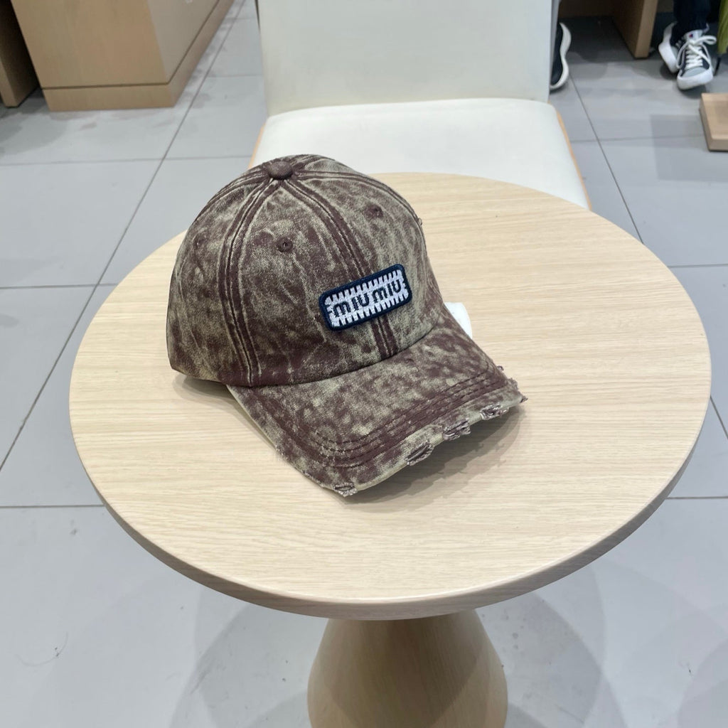 MIU MIU MM DISTRESSED FABRIC BASEBALL CAP IN BROWN WITH EMBROIDERED LOGO