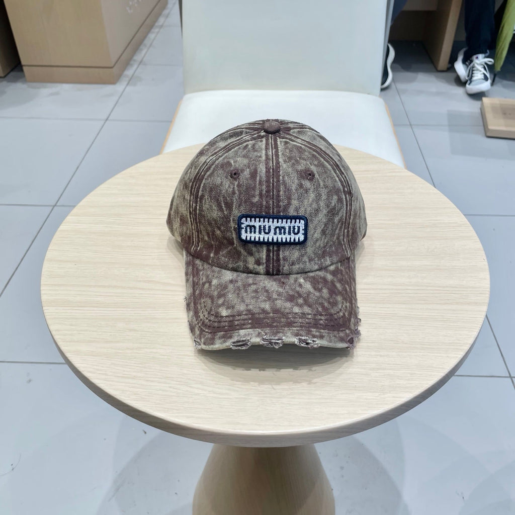 MIU MIU MM DISTRESSED FABRIC BASEBALL CAP IN BROWN WITH EMBROIDERED LOGO
