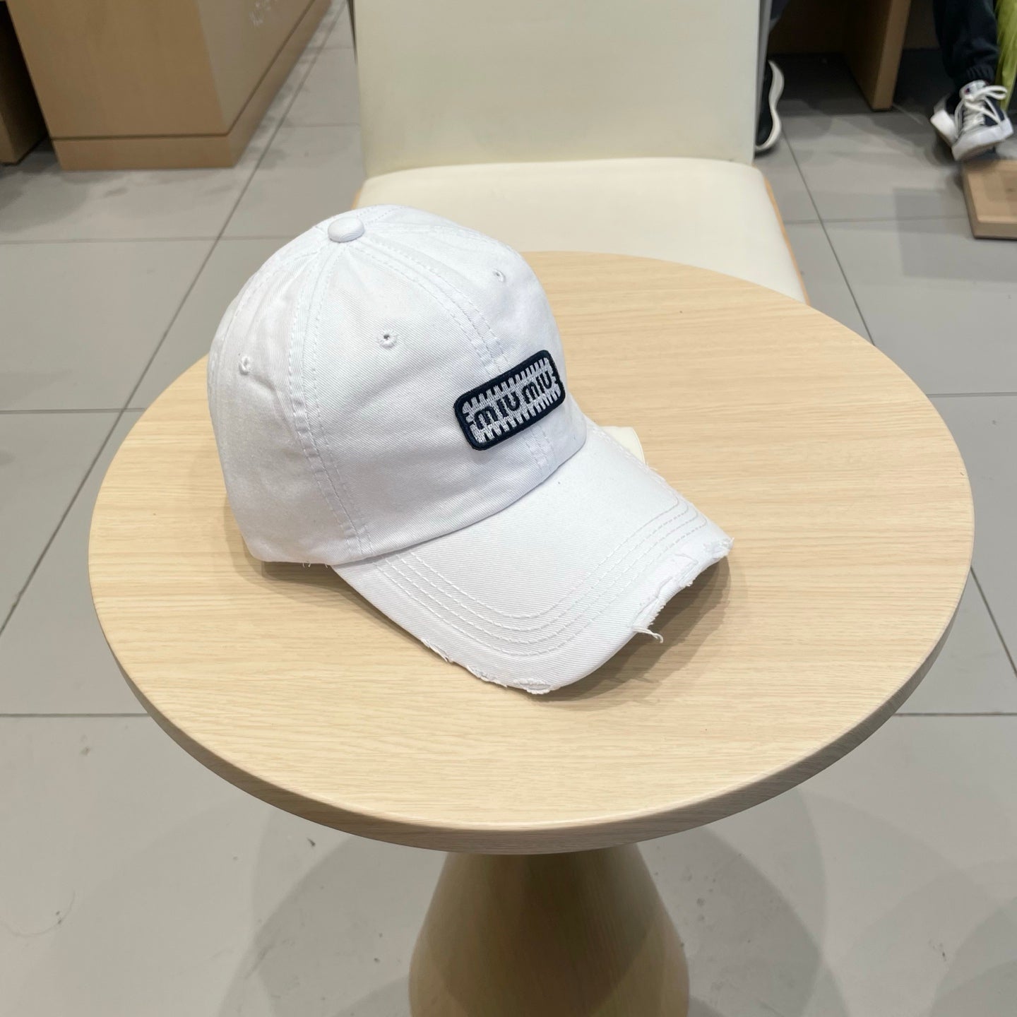 MIU MIU MM DISTRESSED FABRIC BASEBALL CAP IN WHITE WITH EMBROIDERED LOGO
